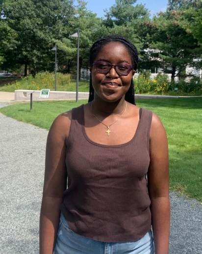 In this picture, peer facilitator Nyasha Jongwe stands on the Dartmouth Campus in the summer