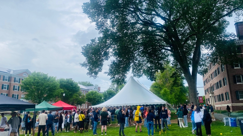Numerous students on Gold Coast Lawn playing lawn games and drinking beverages