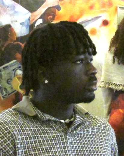 A smiling individual in the center of the picture.