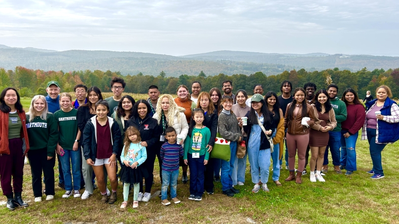 Image of first generation students and their families at an apple picking orchard