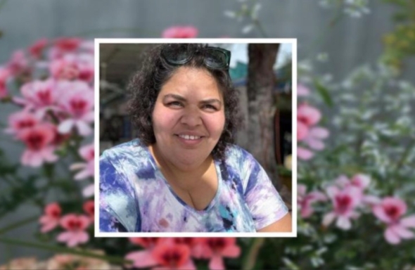A floral memorial of Liz Agosto, a smiling FYSEP alum.