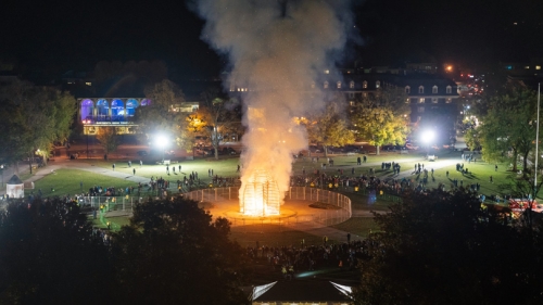 The bonfire lights up the night at last year's homecoming.