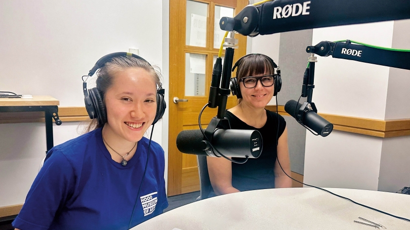 Cara Romero and Kaitlyn Anderson_Audio Tour Two figures in a recording booth.