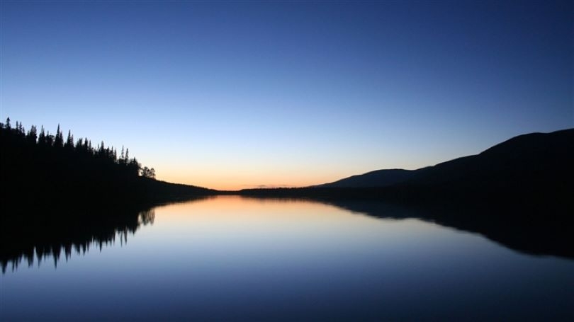 A lstill lake at sunset