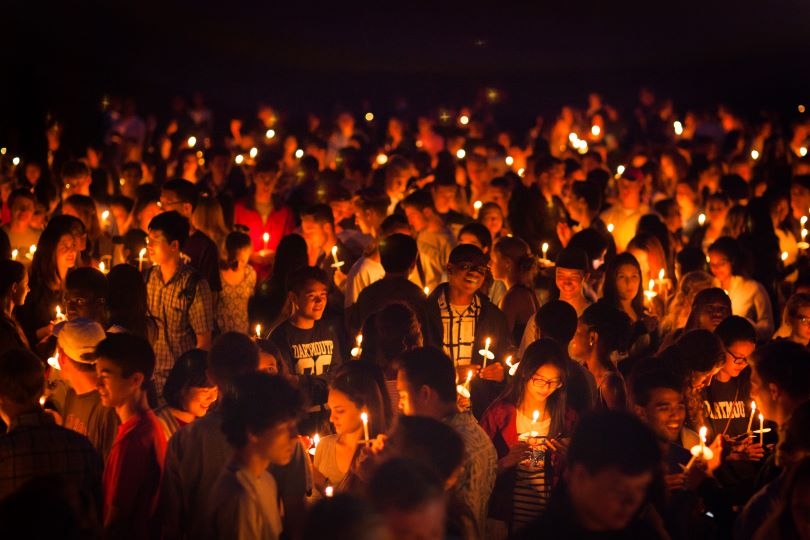 Twilight Ceremony- students gathered with lit candles