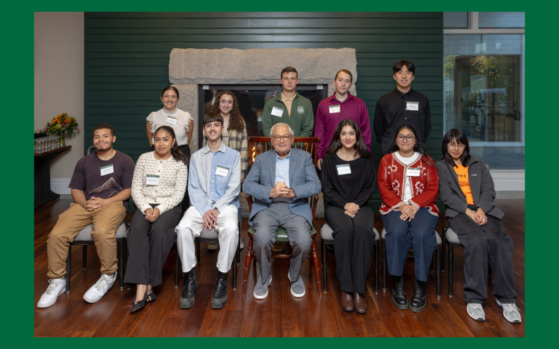 Two rows of undergradaute, Gerstner Scholars seated with Mr. Louis V Gerstner in the center