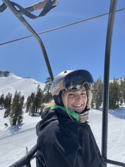 Carly in ski gear looking at camera
